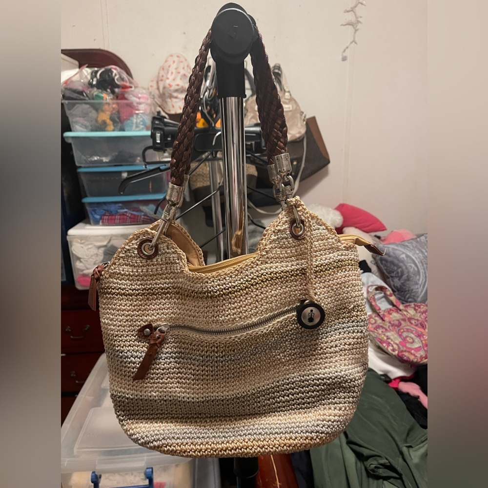 The sak assorted tones of browns weaved medium sized purse